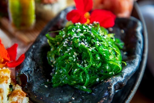 Hiyashi seaweed salad served with black and white sesame seed