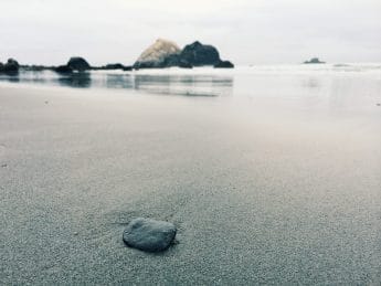 black stone on shoreline